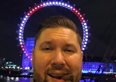 Picture of Danan Coleman with the London Eye in the background - Photograph by Adventure With Danan