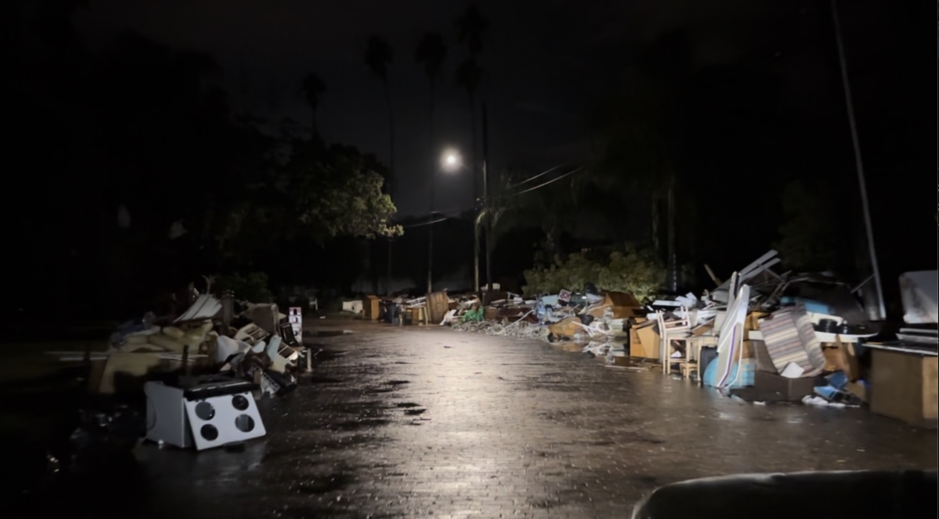 Coming Home to the Storm 4 A stove sitting on the curb among the debris