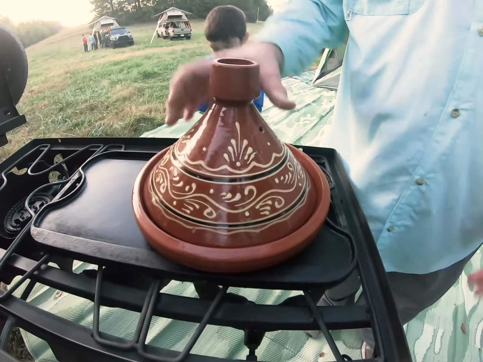 Campsite Cooking: Chicken Tagine with the Overland Crew 2 A decorated Moroccan clay tagine warming up on a camp griddle