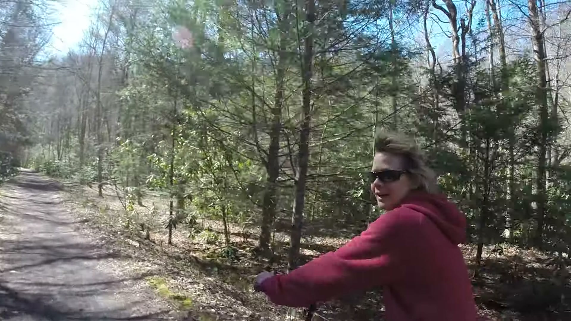 Biking the Virginia Creeper Trail, Whitetop to Damascus 20 A friend in a red hoodie smiling on the Creeper Trail