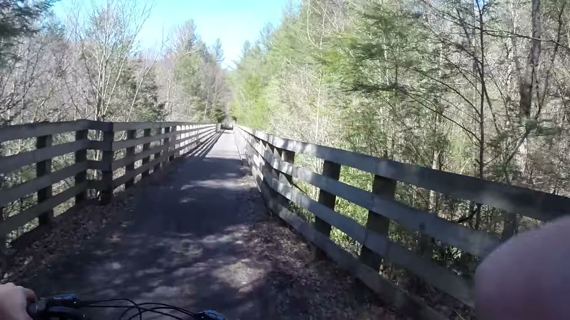 Biking the Virginia Creeper Trail, Whitetop to Damascus 18 Crossing a wooden trestle through the woods