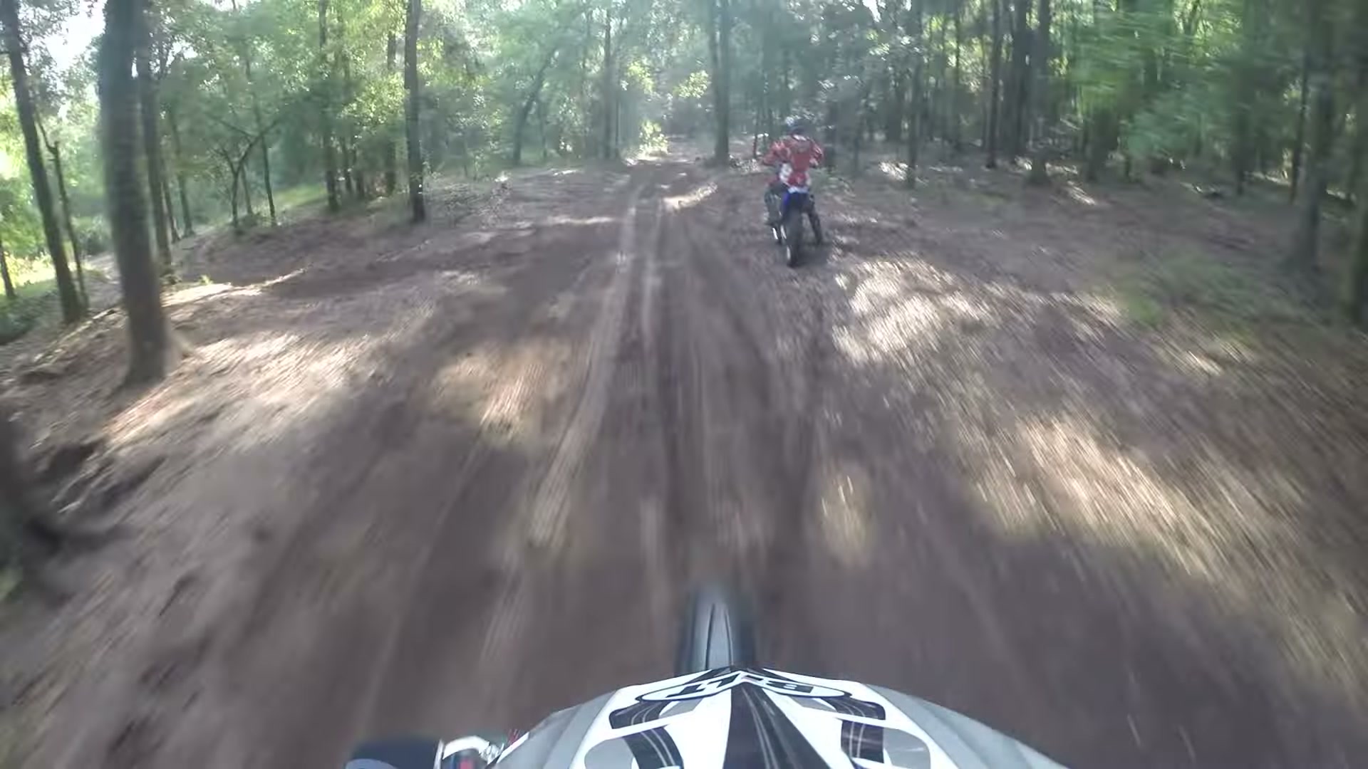 Dirt Biking the Croom Motorcycle Area 9 A rider ahead on a sandy forest trail at Croom