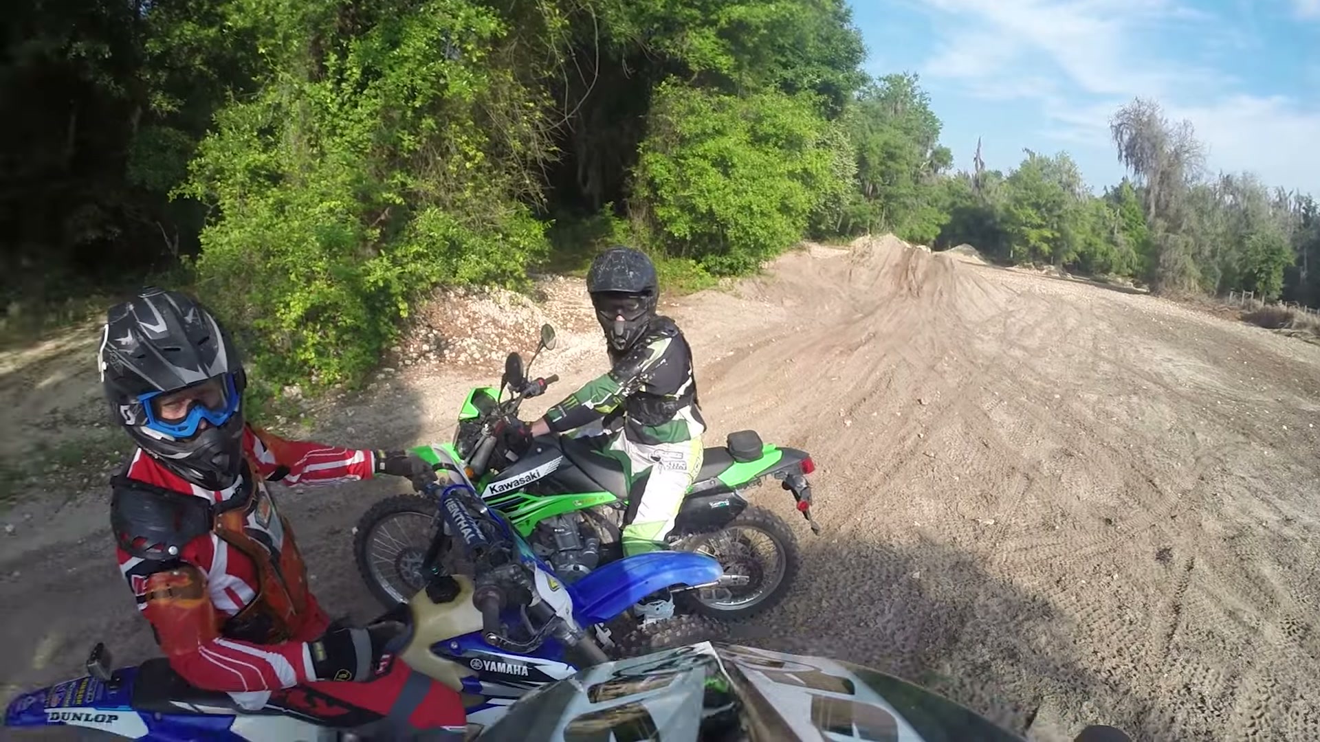 Dirt Biking the Croom Motorcycle Area 5 Two riders on a Yamaha and a Kawasaki taking a break by a sand pile at Croom
