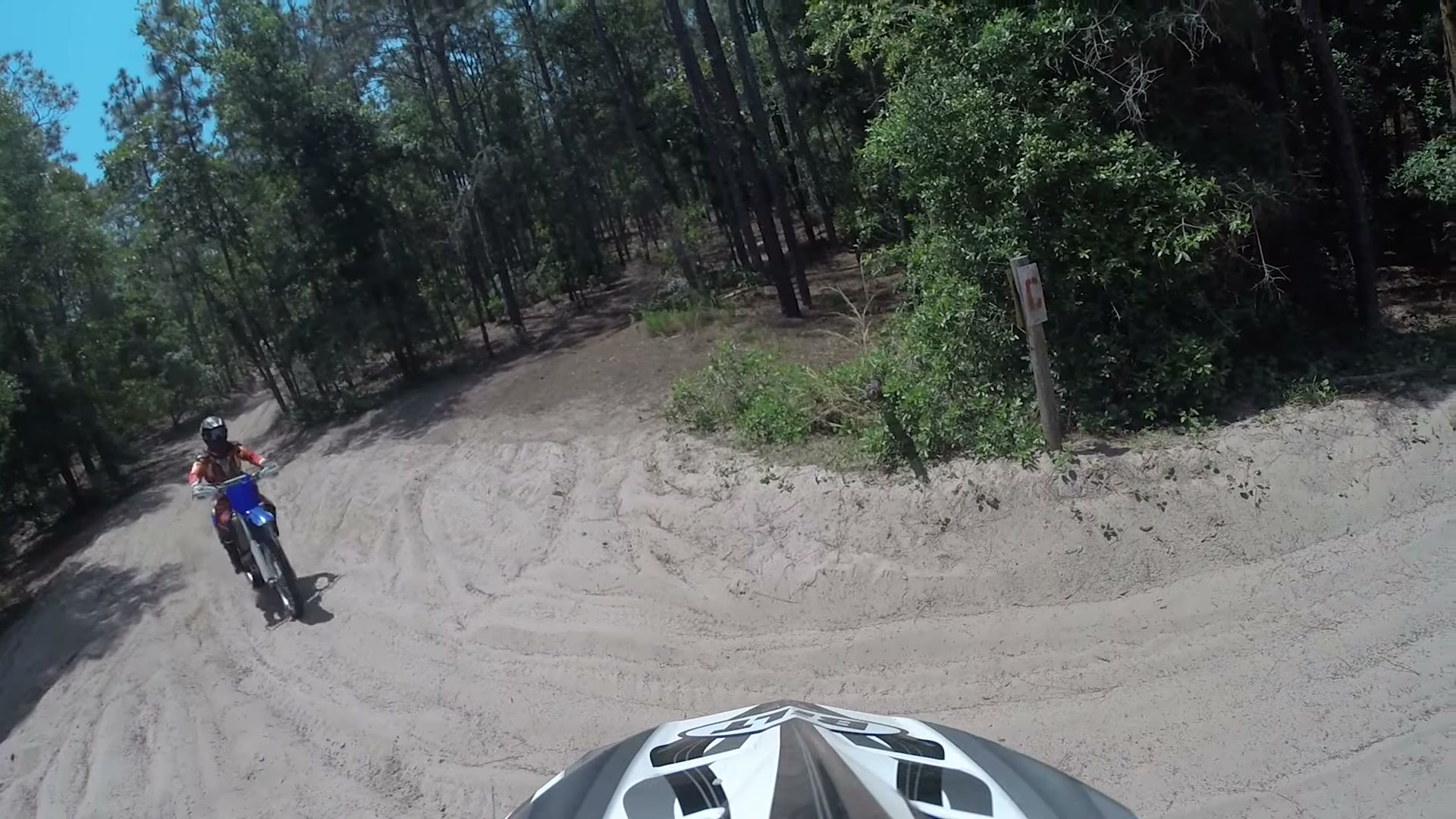 Dirt Biking the Croom Motorcycle Area 6 A rider in red gear on a blue Yamaha carving a corner in a sand bowl at Croom