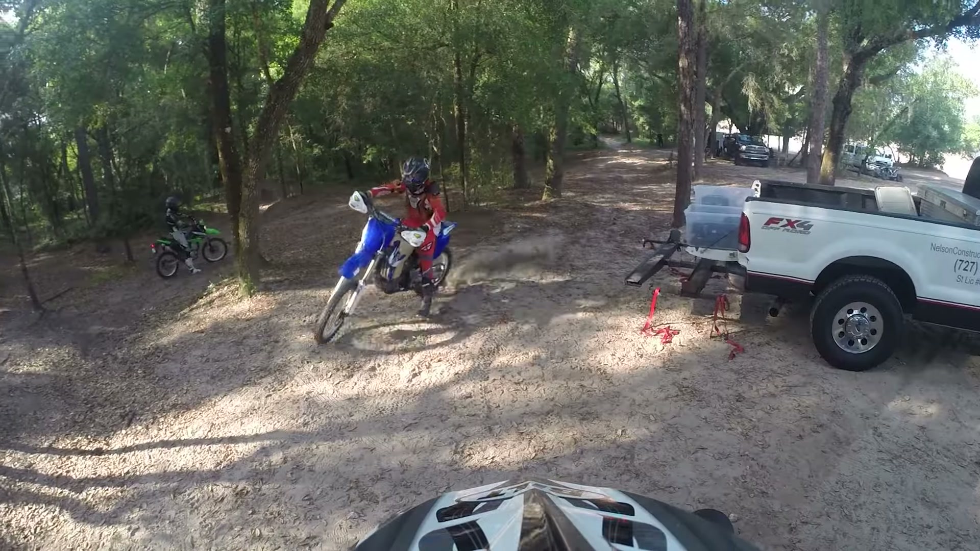 Dirt Biking the Croom Motorcycle Area 7 Riders unloading dirt bikes under the oaks at the Croom staging area