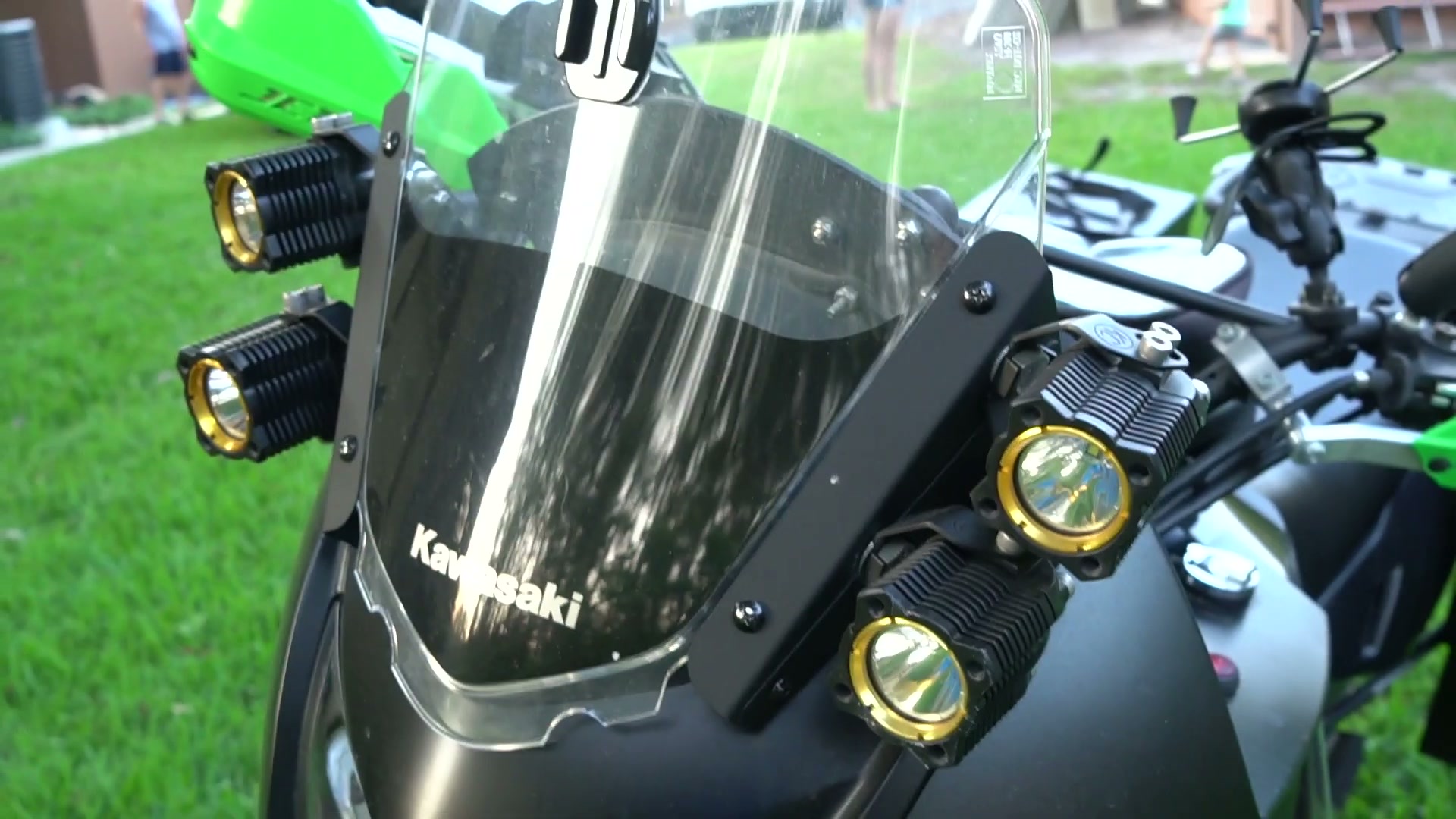 My Kawasaki KLR 650 Adventure Bike Build for the Trans America Trail 2 Four KC lights mounted on a KLR Dash around the windshield of a Kawasaki KLR 650