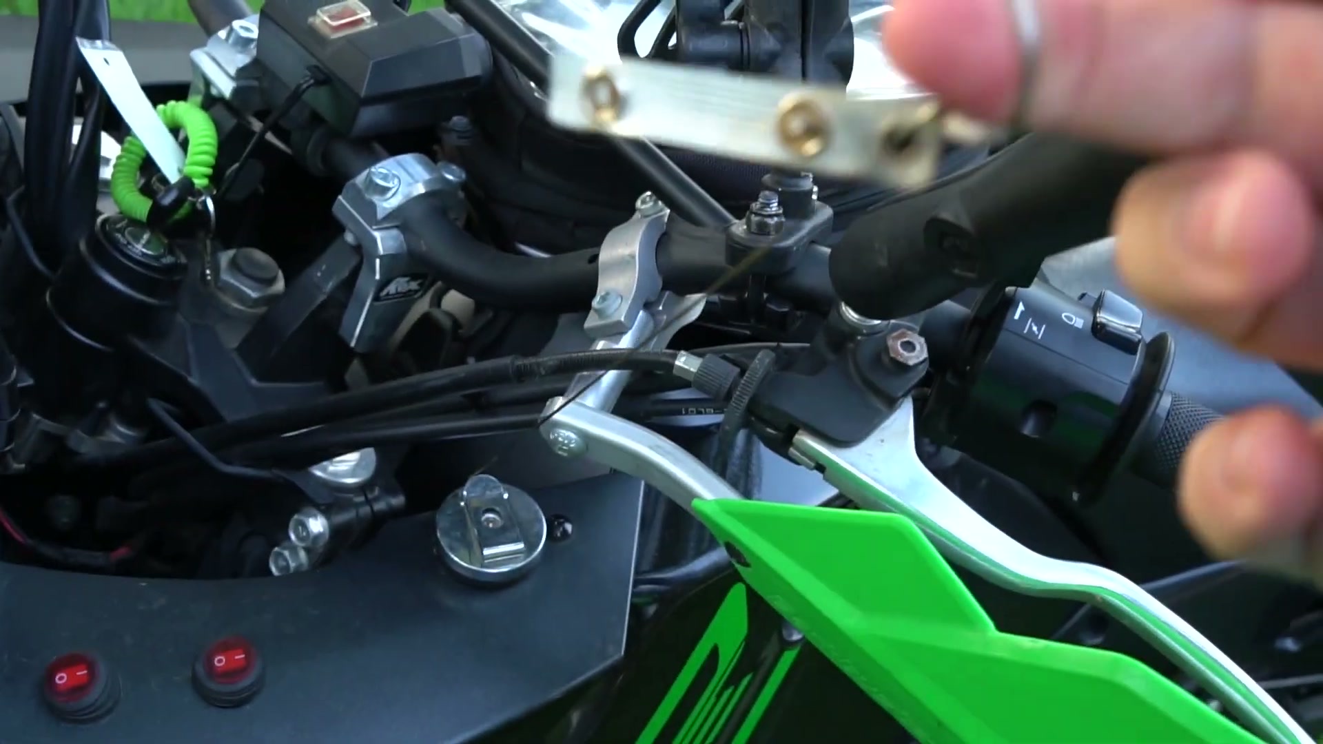 My Kawasaki KLR 650 Adventure Bike Build for the Trans America Trail 3 The light switches and cockpit of the KLR 650 with the retractable rag reel under the cowling