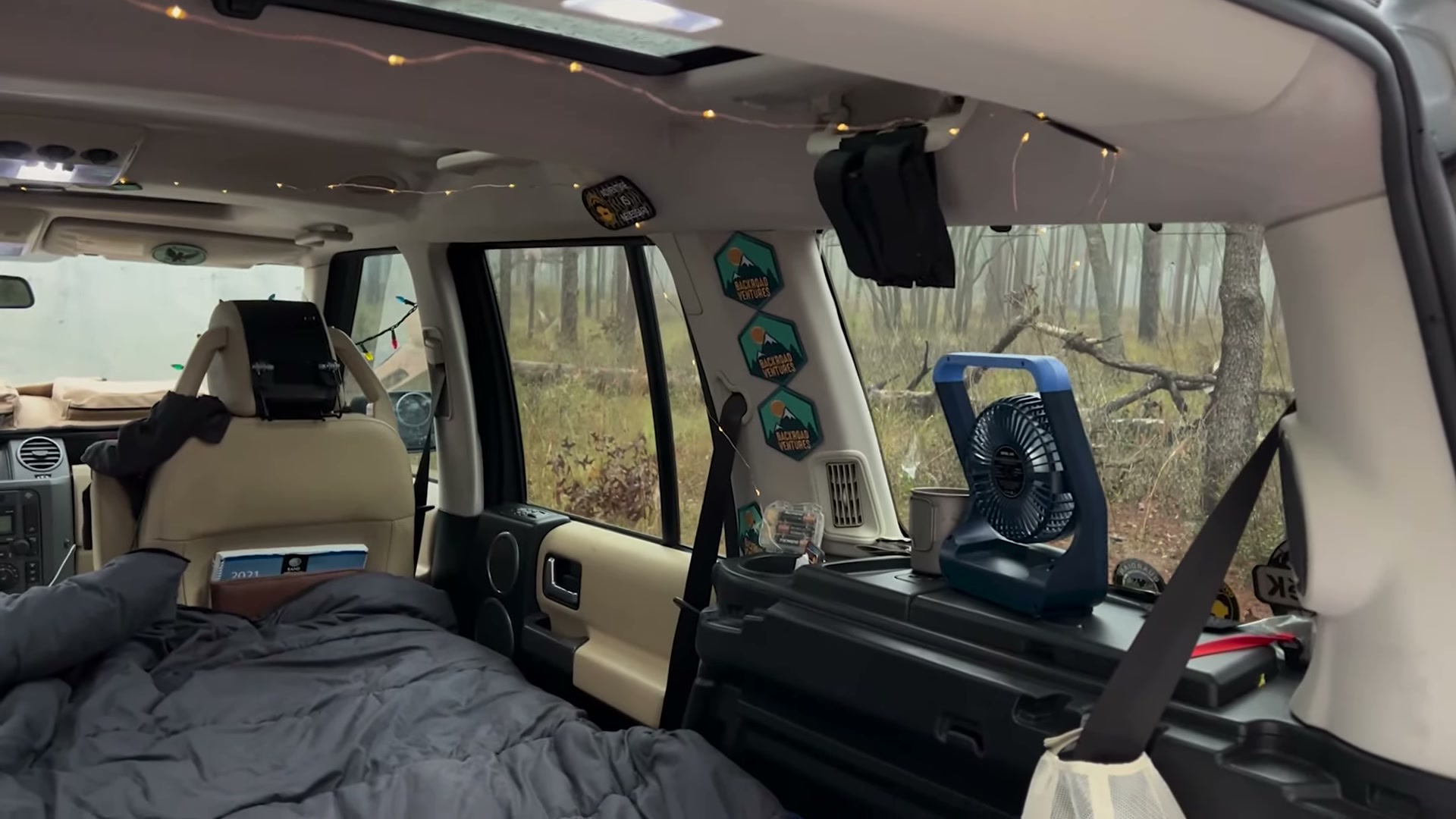 One Night in Ocala National Forest: Camp Cooking, Car Camping and Lake Dorr 5 The inside of the Land Rover LR3 set up for sleeping with a battery fan clipped near the seats