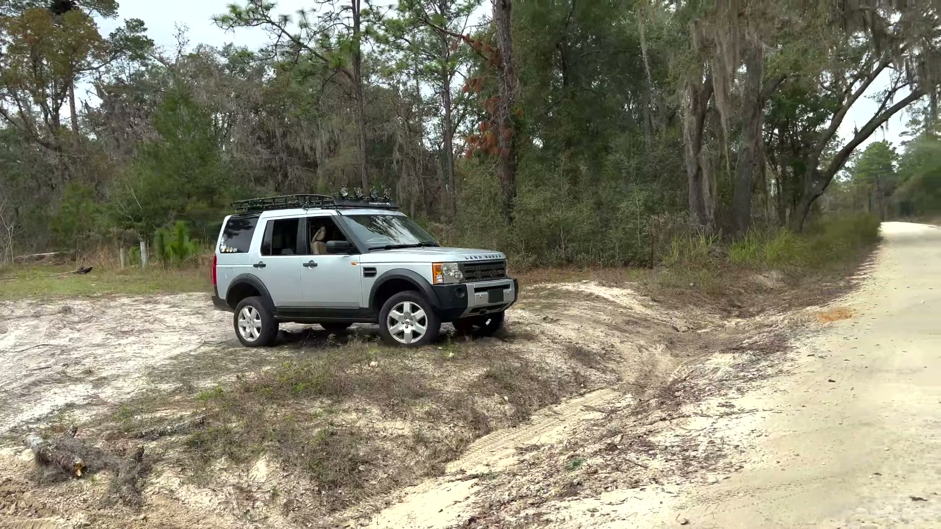 One Night in Ocala National Forest: Camp Cooking, Car Camping and Lake Dorr 8 The silver Land Rover LR3 climbing out of soft sand onto a forest road in Ocala National Forest