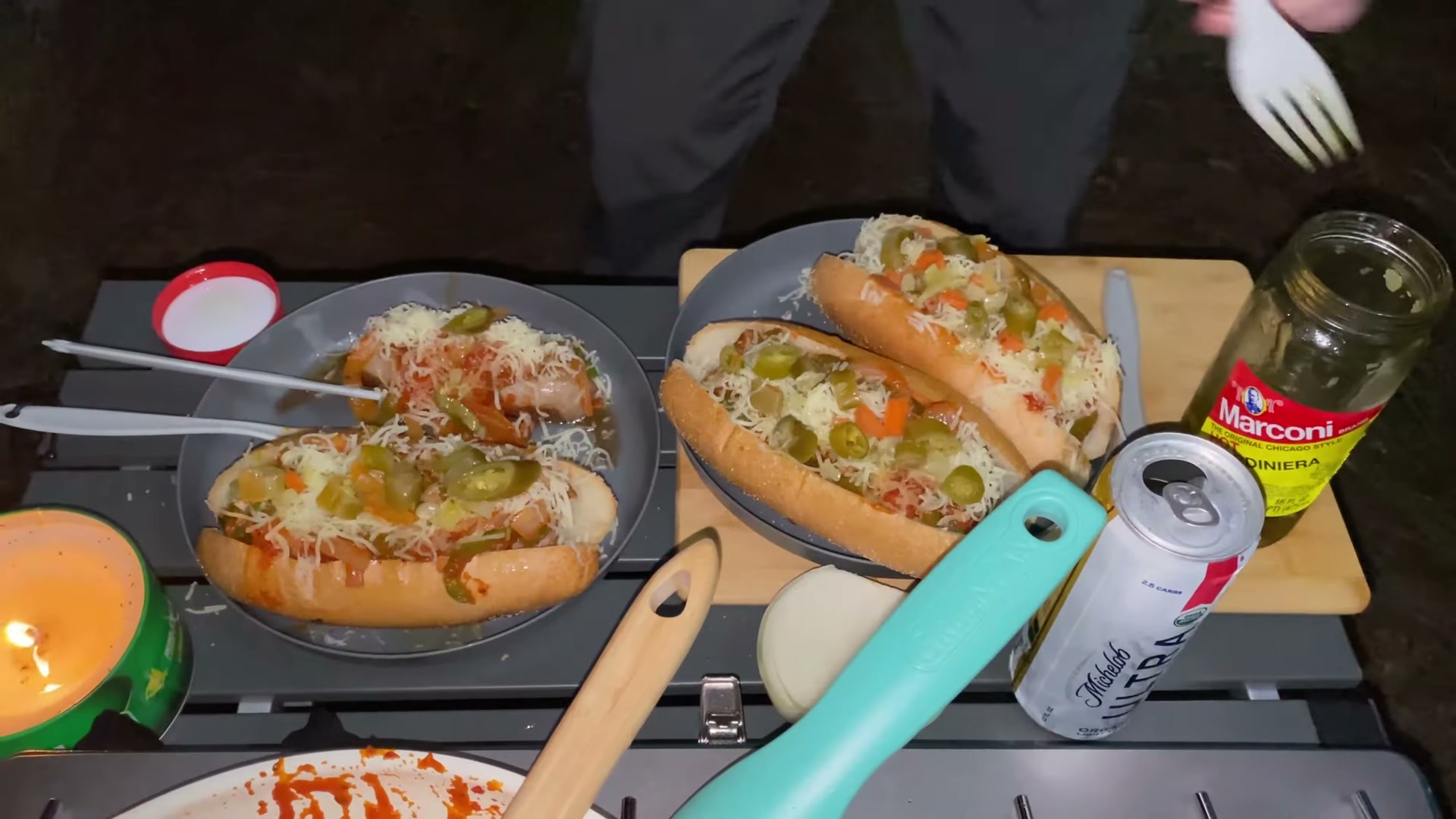 One Night in Ocala National Forest: Camp Cooking, Car Camping and Lake Dorr 3 Sausage and onion subs on plates at the camp kitchen in Ocala National Forest