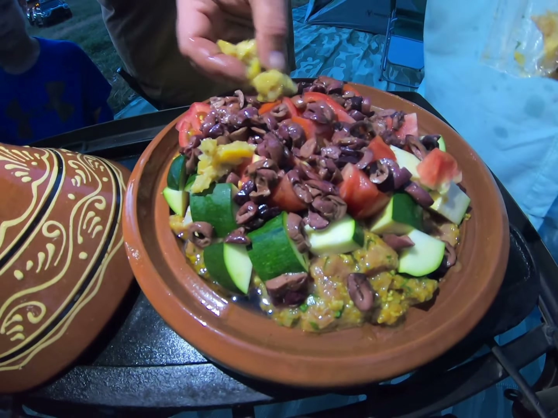 Campsite Cooking: Chicken Tagine with the Overland Crew 7 Chopped preserved lemon going on top of the tagine layers