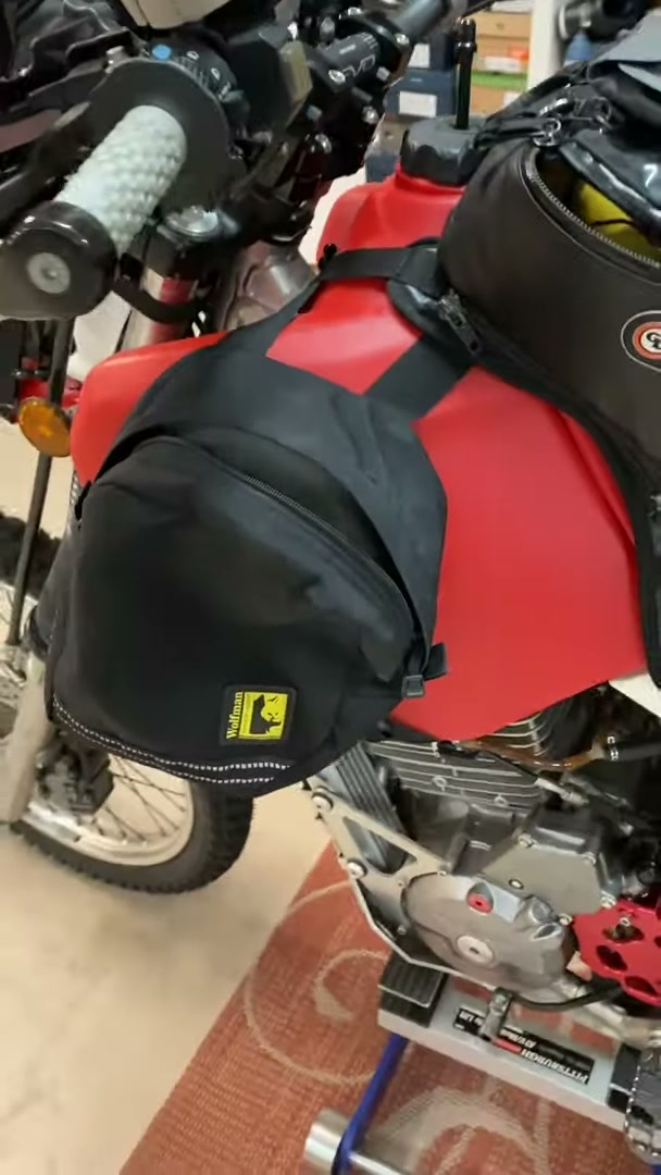 Packing a Motorcycle for a 30-Day Adventure Ride 8 Wolfman tank panniers on the red tank of a Honda XR650L